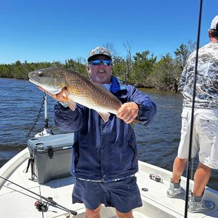 One fishing enthusiast reeling in a catch in Florida