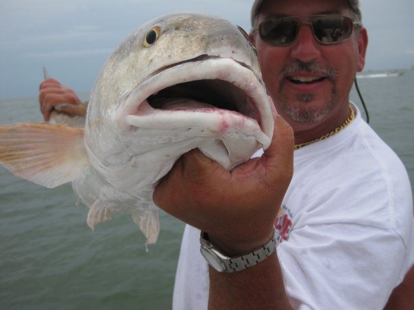 A person fishing in League City