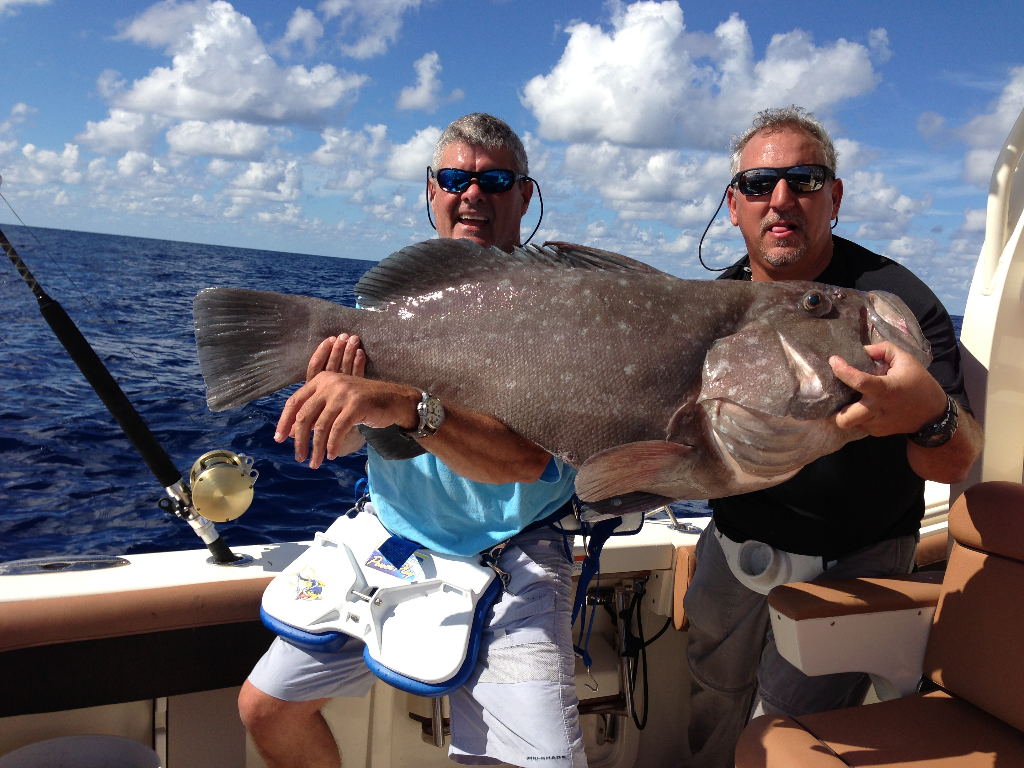A great catch! Two anglers proudly display their prize in League City.