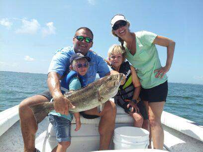 Smiling anglers with their catch in Palmetto