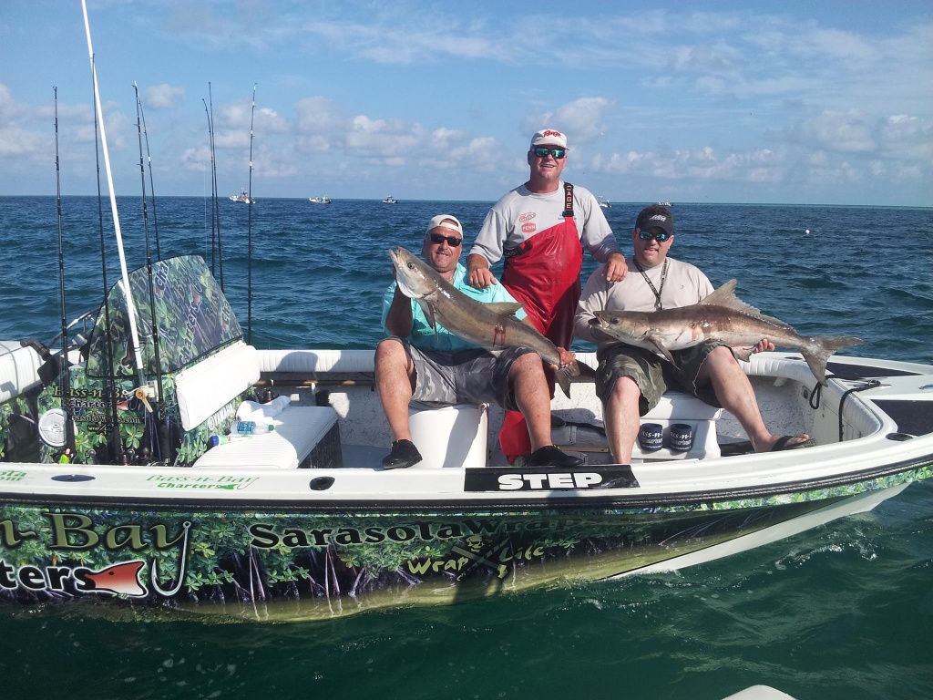 3 people fishing with 2 big fish in FL