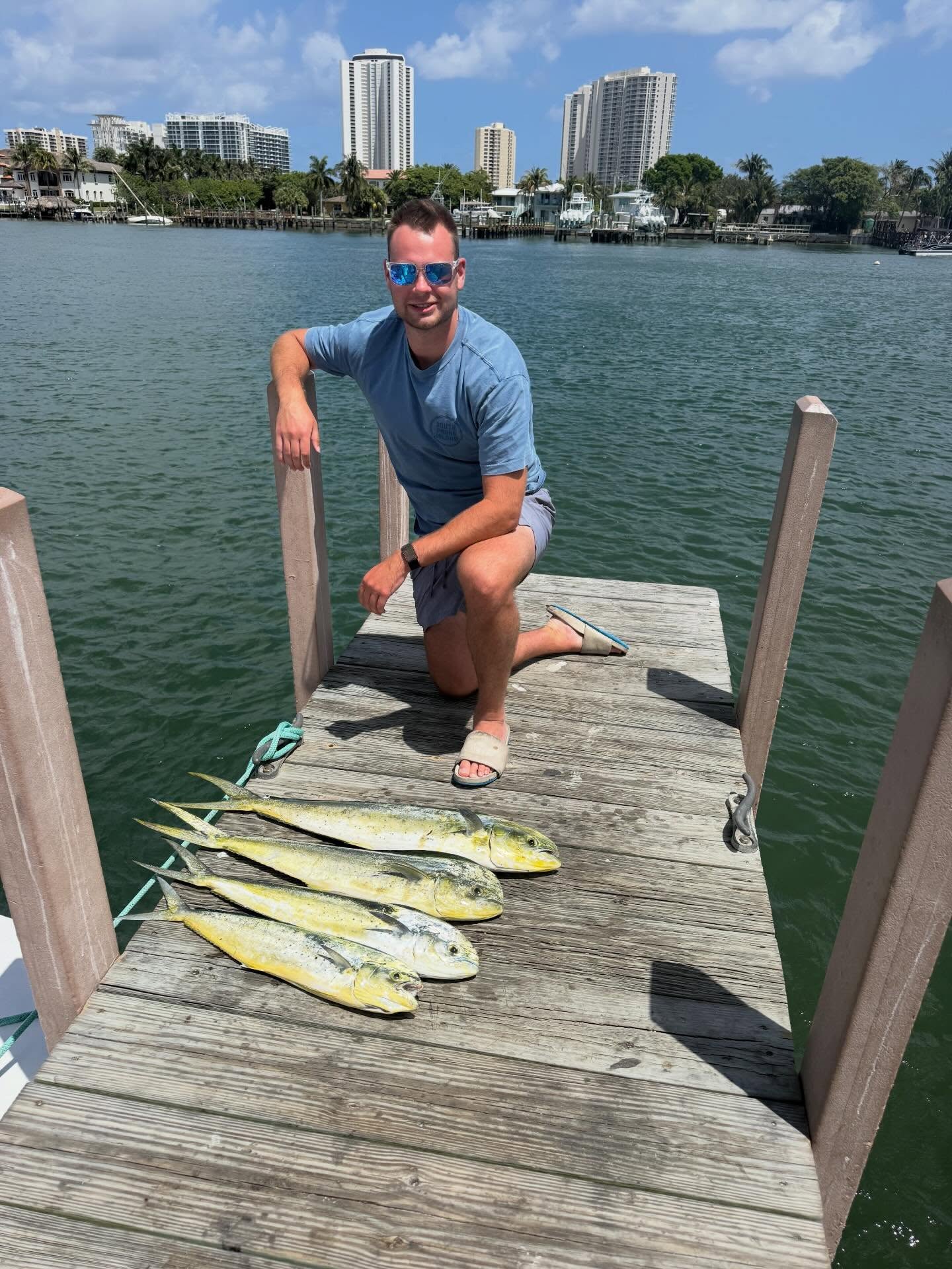 Fresh caught mahi mahi displayed on wooden dock in Palm Beach FL