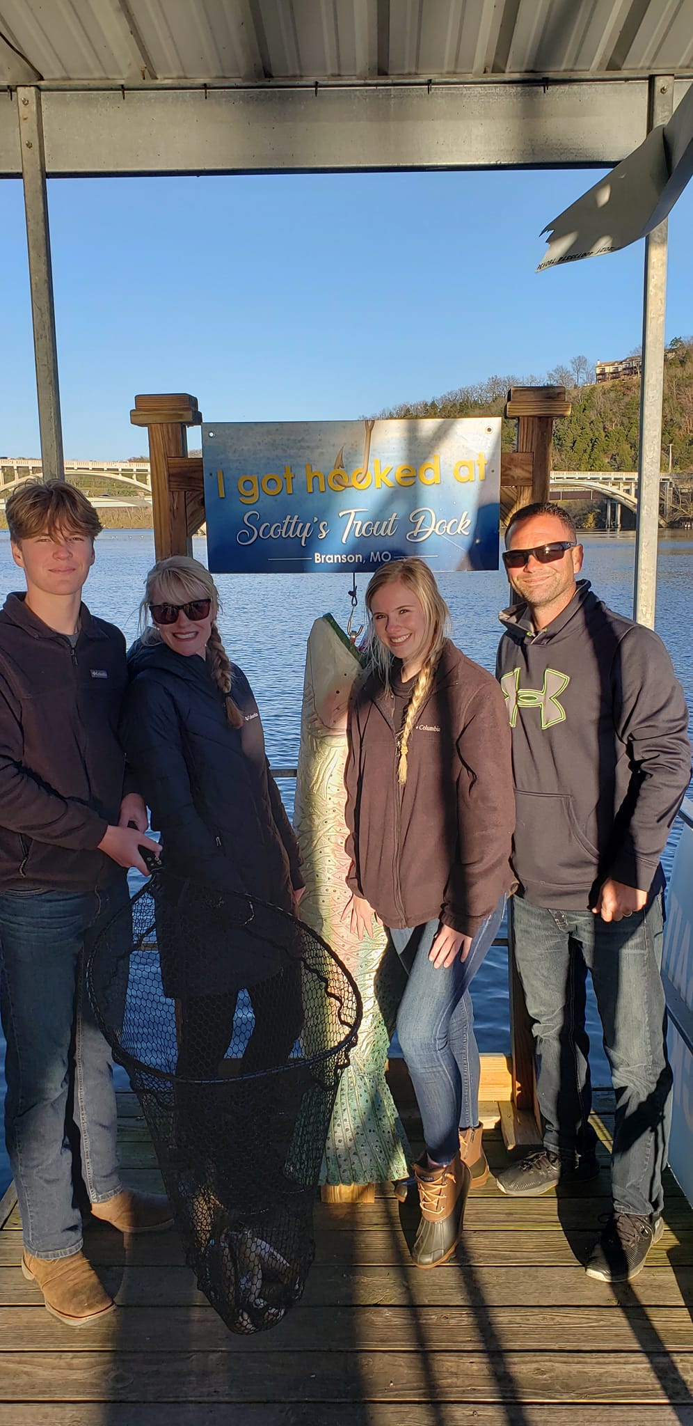 Four people enjoying a fishing trip in Missouri