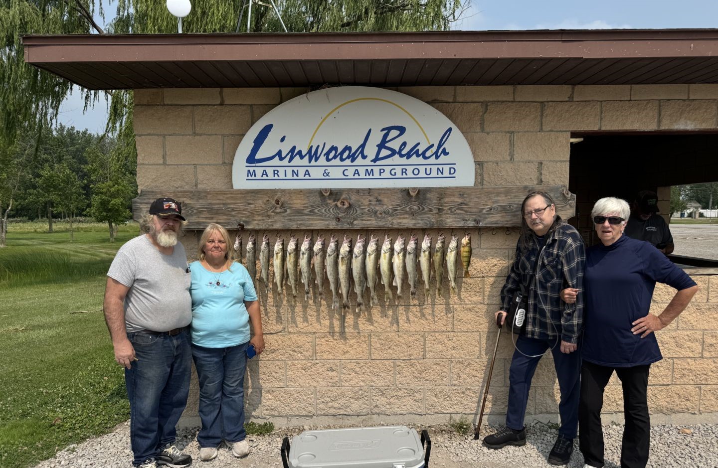 Fish cleaning station display with multiple caught fish hanging at Linwood Beach Marina in Michigan