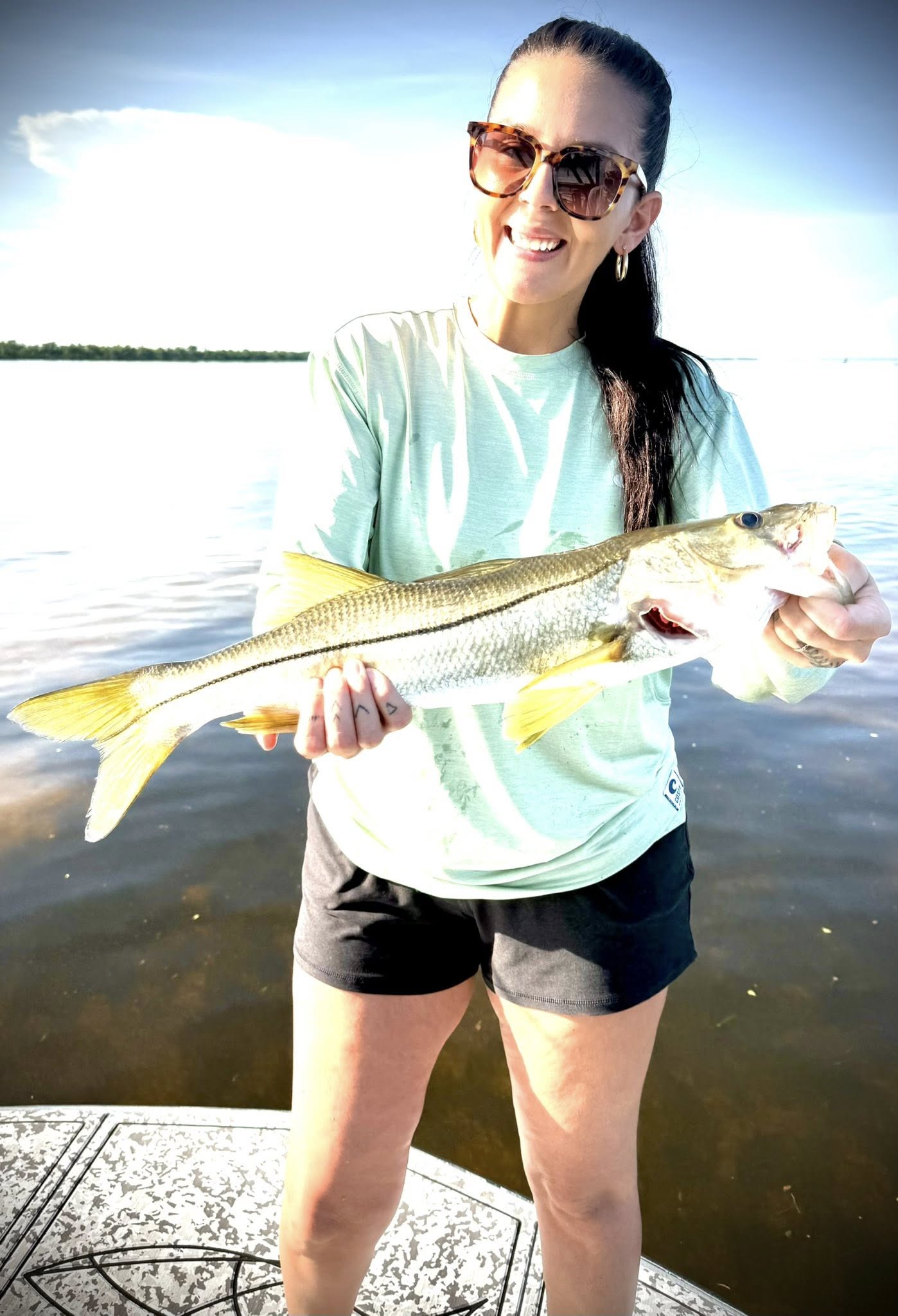 A person fishing for a snook in FL
