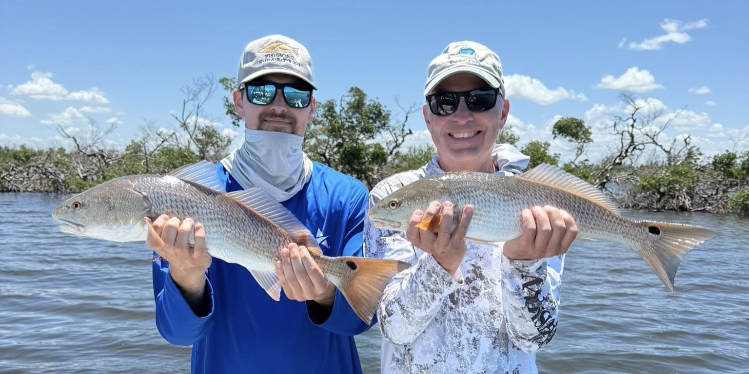 Charlotte Harbor inshore fishing charter boat with anglers catching snook and redfish
