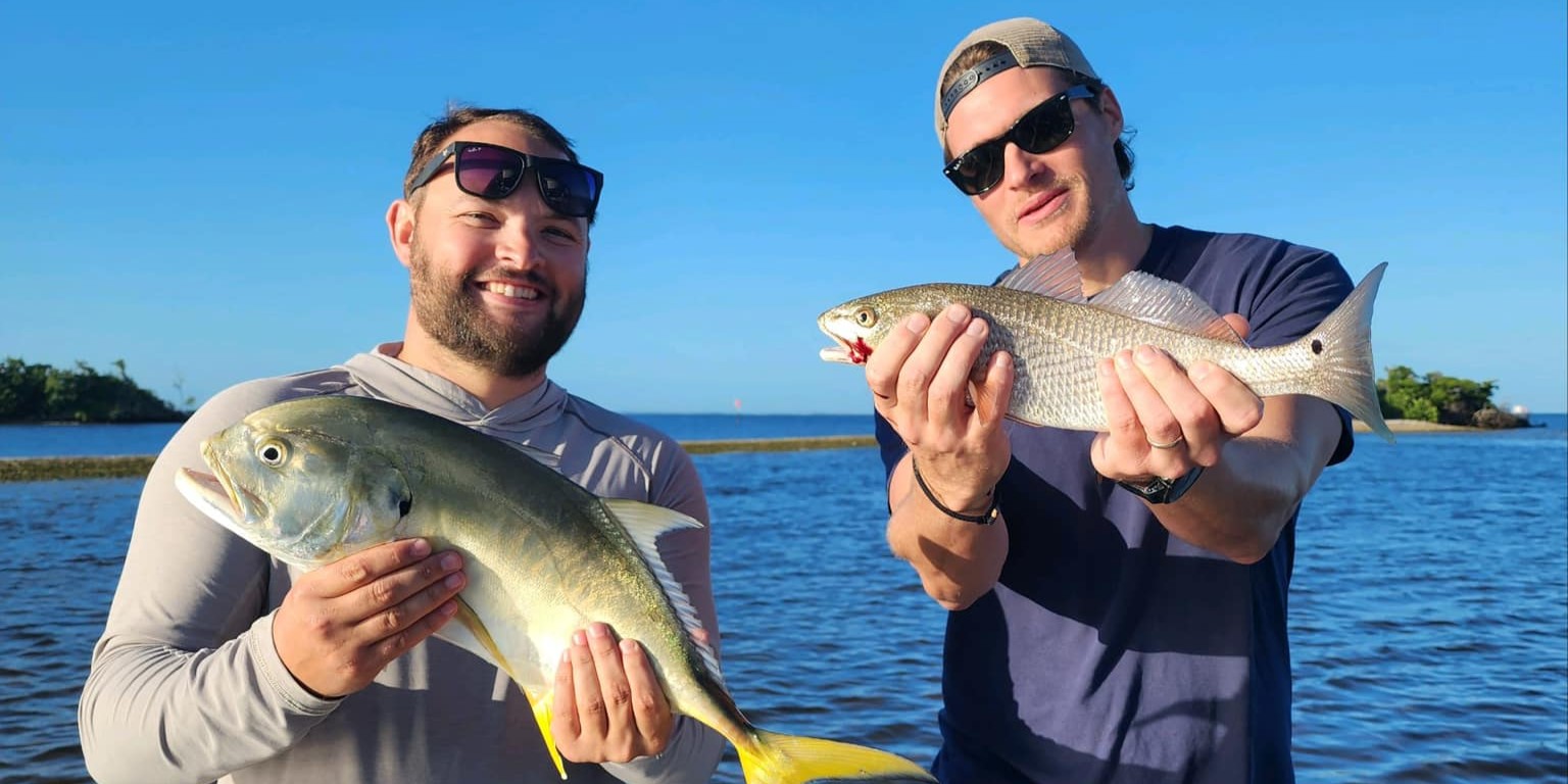 Charlotte Harbor tarpon fishing charter boat with anglers targeting large silver tarpon fish