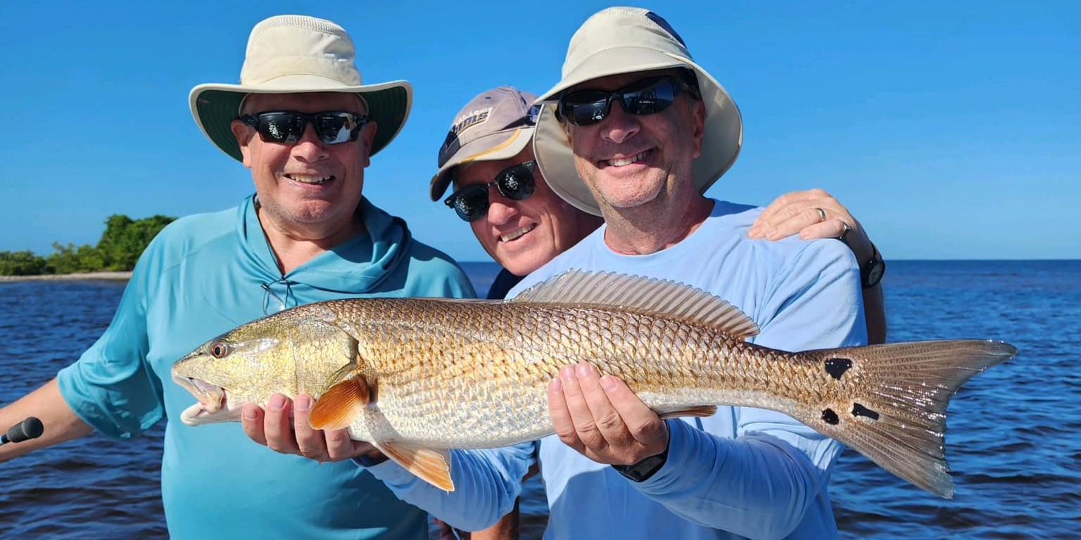Charlotte Harbor inshore fishing charter boat with anglers targeting snook and redfish