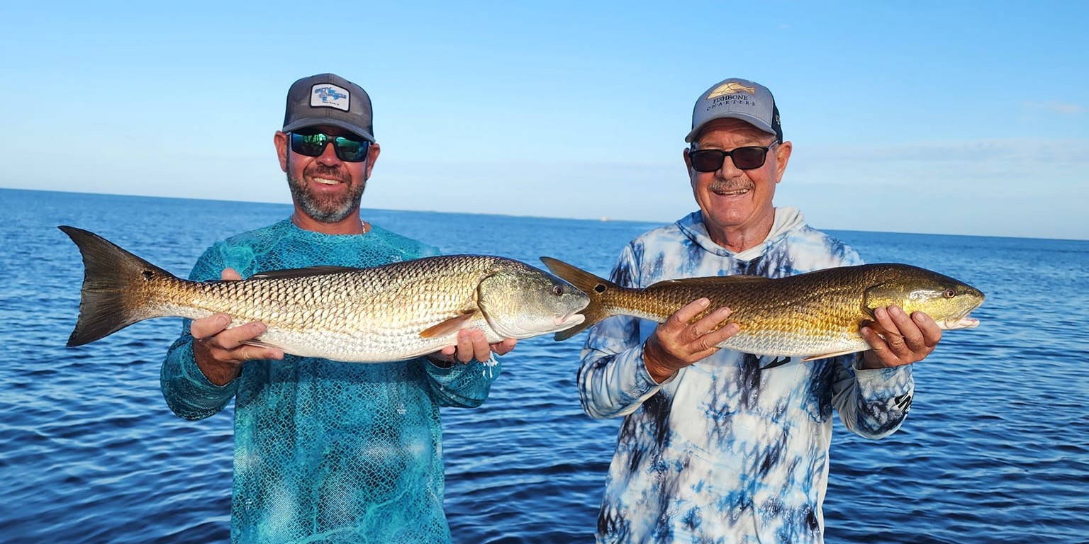 Charlotte Harbor inshore fishing charter boat with anglers casting lines for snook and redfish