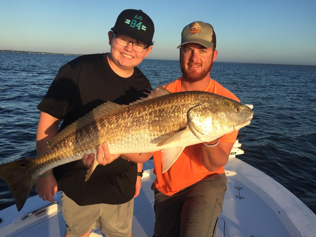 Two people fishing in Freeport