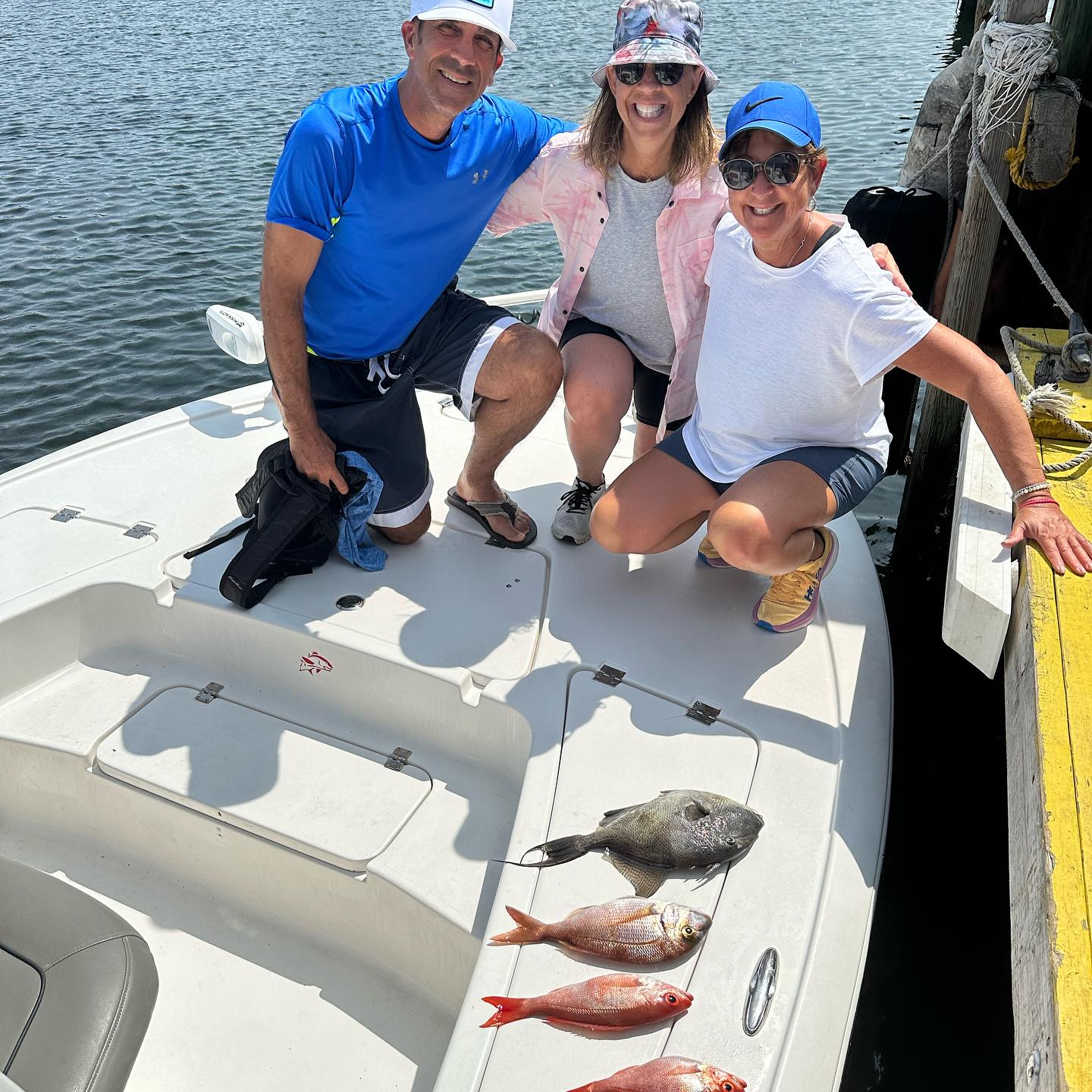 3 fishing rods with a view of the Panama City Beach, Florida coastline