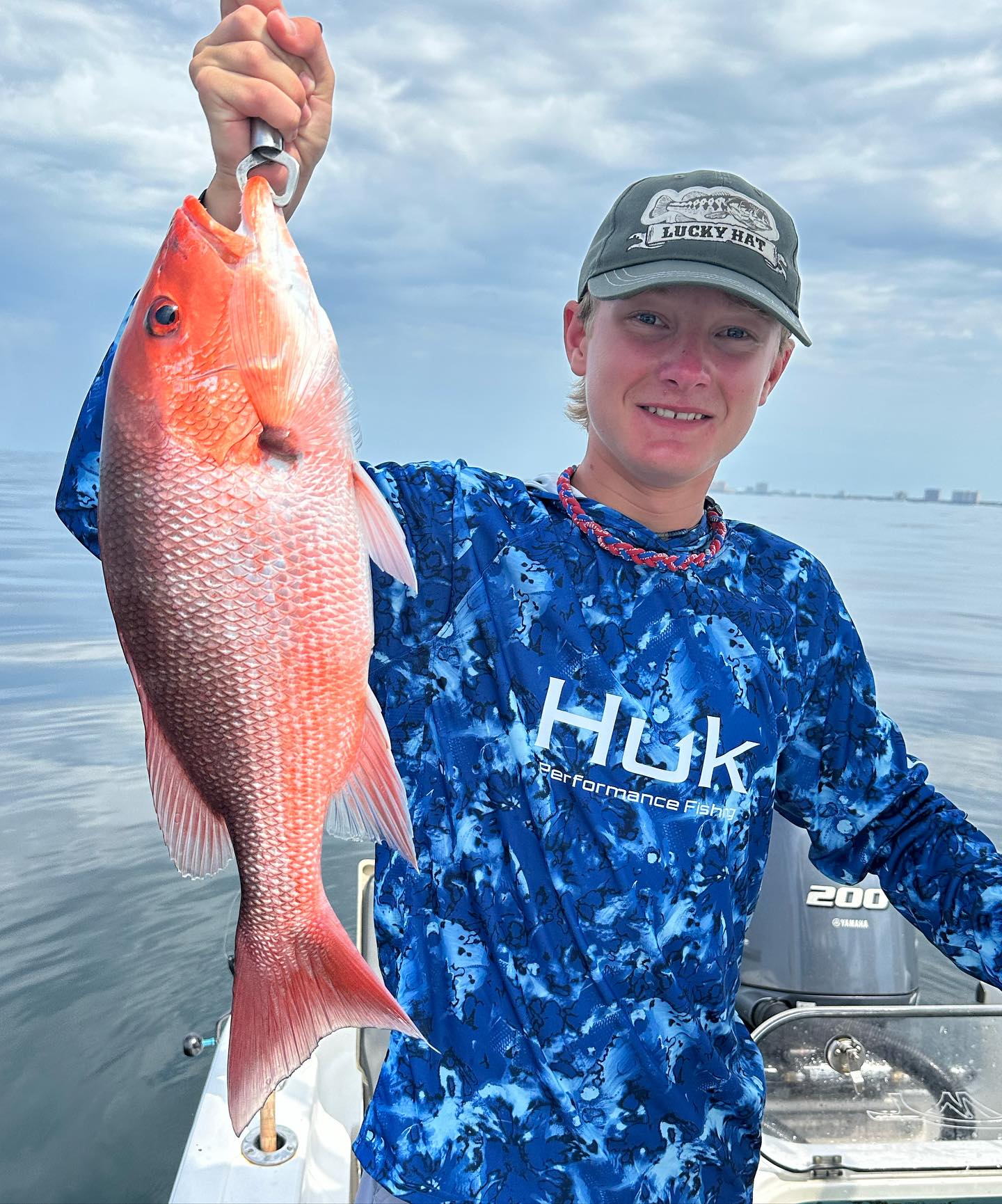 Angler with a 21-inch grey snapper fish in Panama City Beach