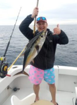 A lone fisherman reeling in a catch in FL