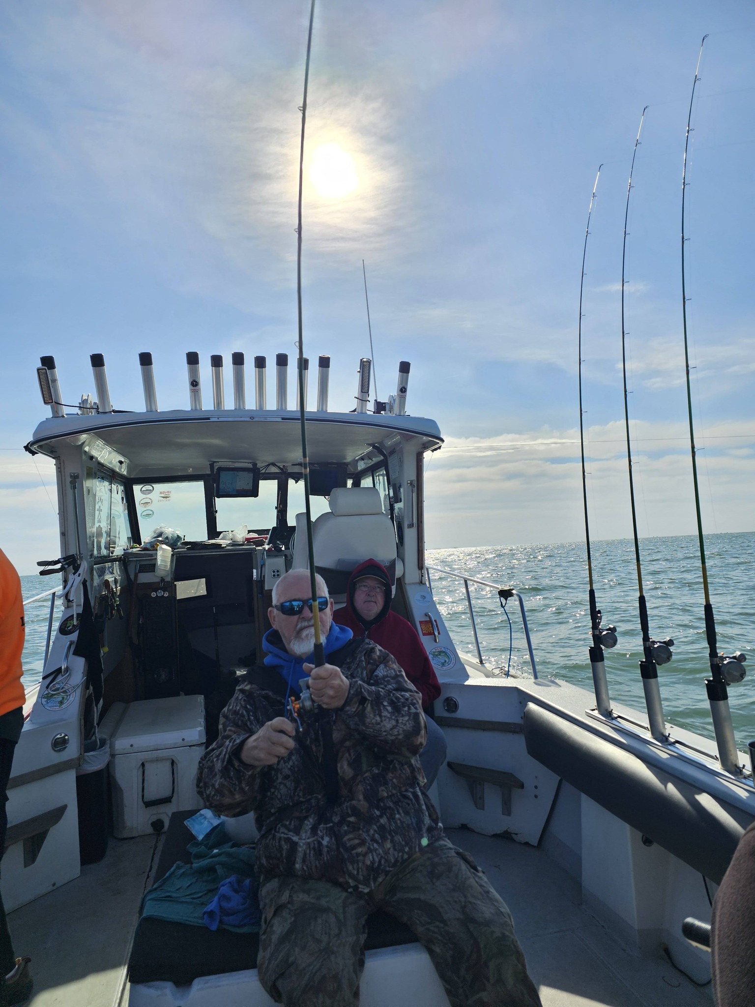 Fishing boat with multiple rod holders and fishing equipment on the water in Port Clinton OH