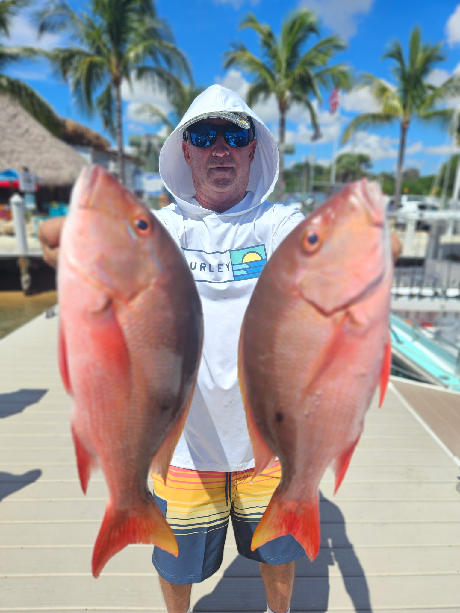 Angler fishing in Jupiter with 2 fish