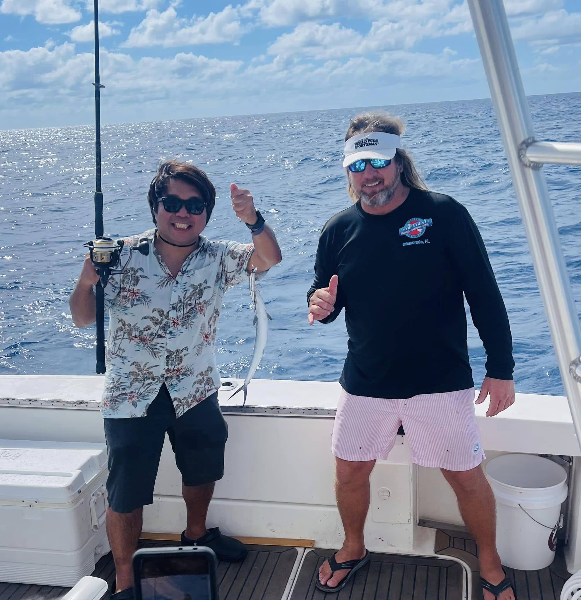 A couple fishing in FL with 1 fish