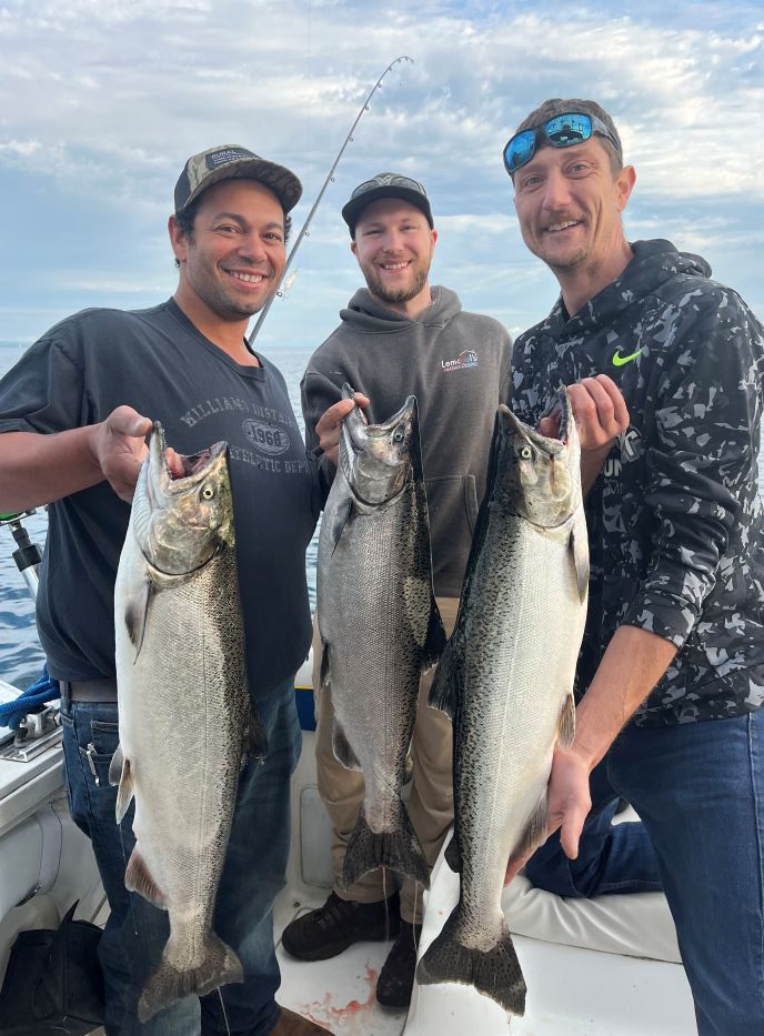 Three Chinook Salmon and Lake Trout caught while fishing in Glen Arbor