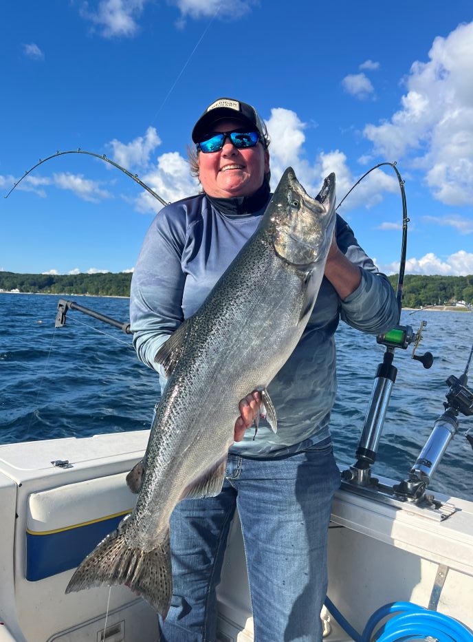 Smiling person in Glen Arbor with fishing gear