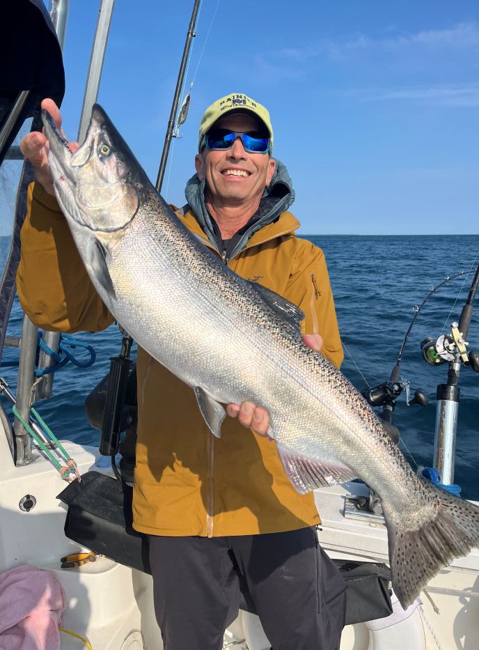 Fishing charter boat on Lake Michigan near Glen Arbor with salmon and trout fishing gear