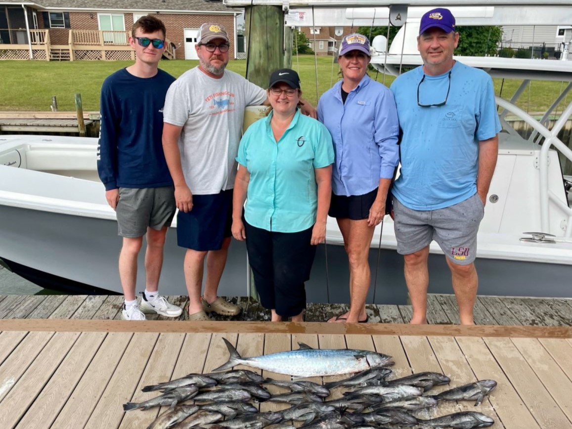 5 people fishing on the coast of Cape Carteret