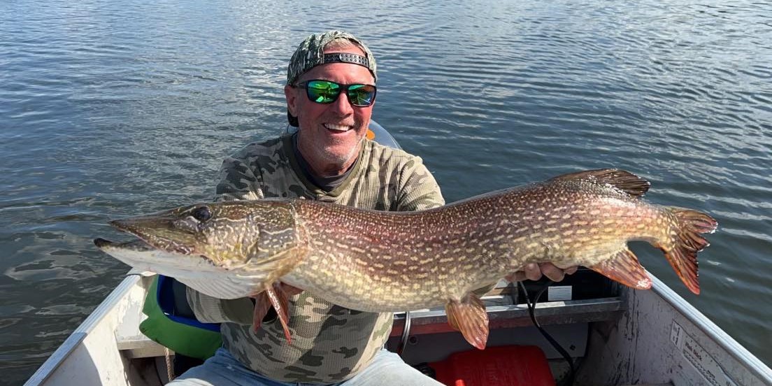 Fisherman with a large northern pike in Southend