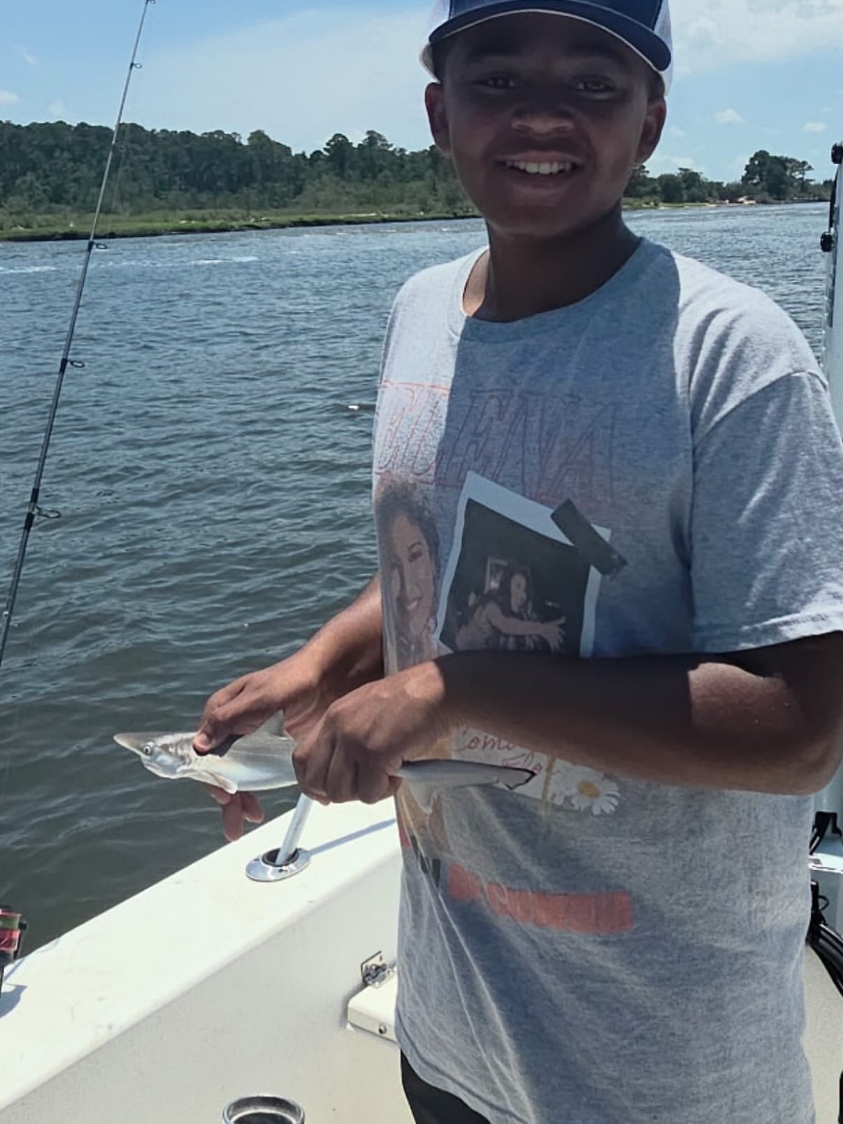 Angler holding caught fish on fishing boat at Carolina Beach NC