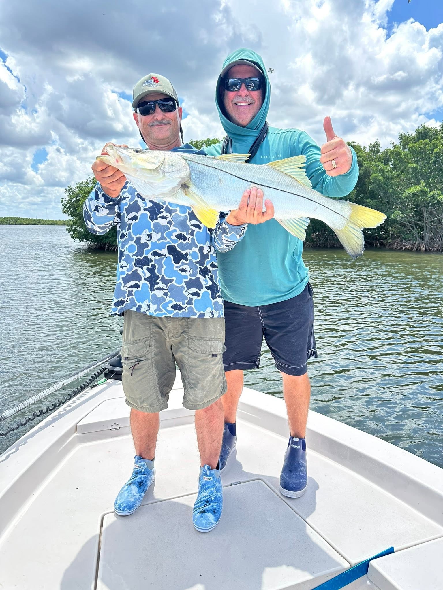 Successful snook fishing catch on boat in Riverview FL waters
