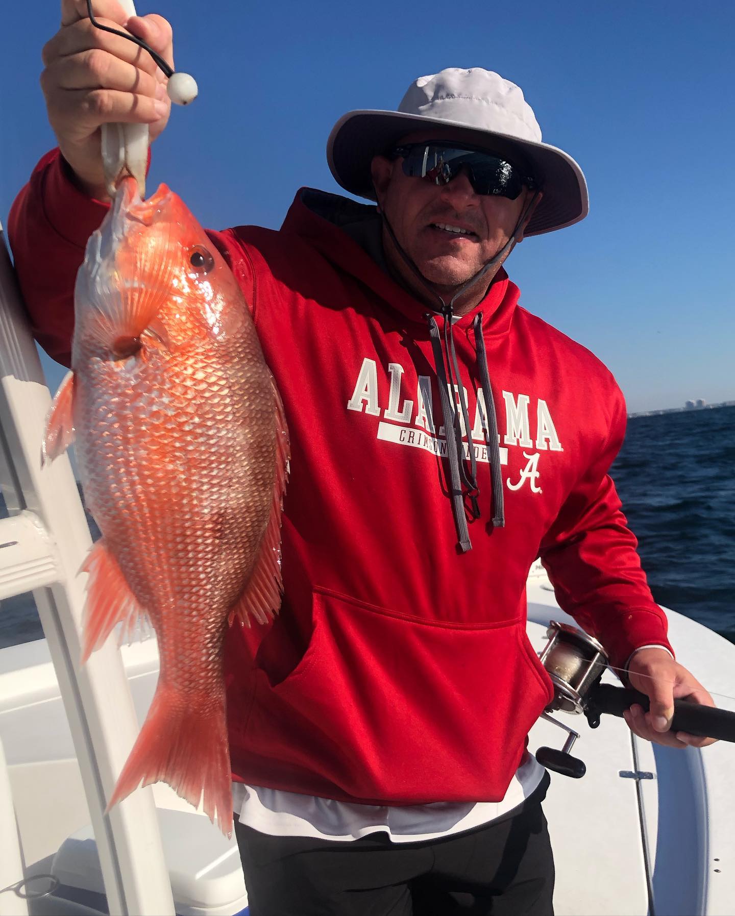 Man fishing in FL with a rod and reel