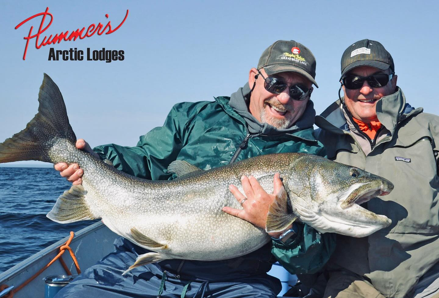 Angler holding a large lake trout in the NT region