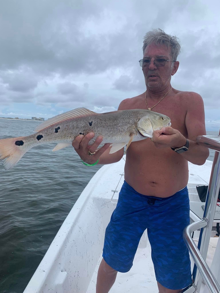 A single fisherman enjoying a day of fishing in Orange Beach