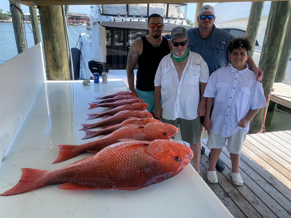 4 people fishing at Orange Beach