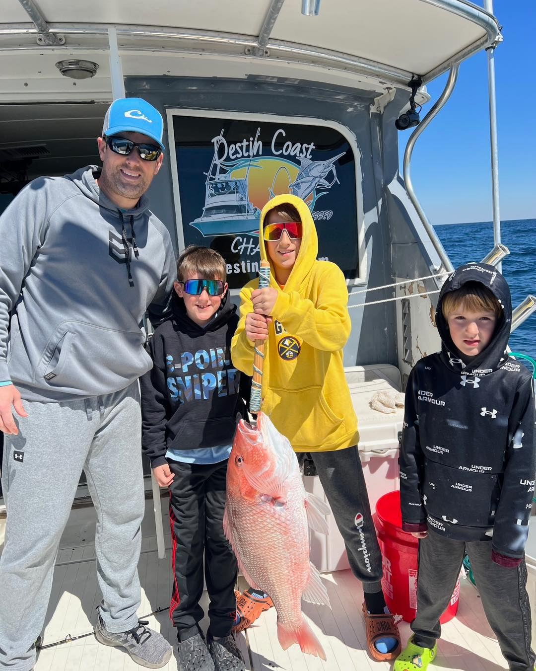 A group of 4 people fishing at Fort Walton Beach