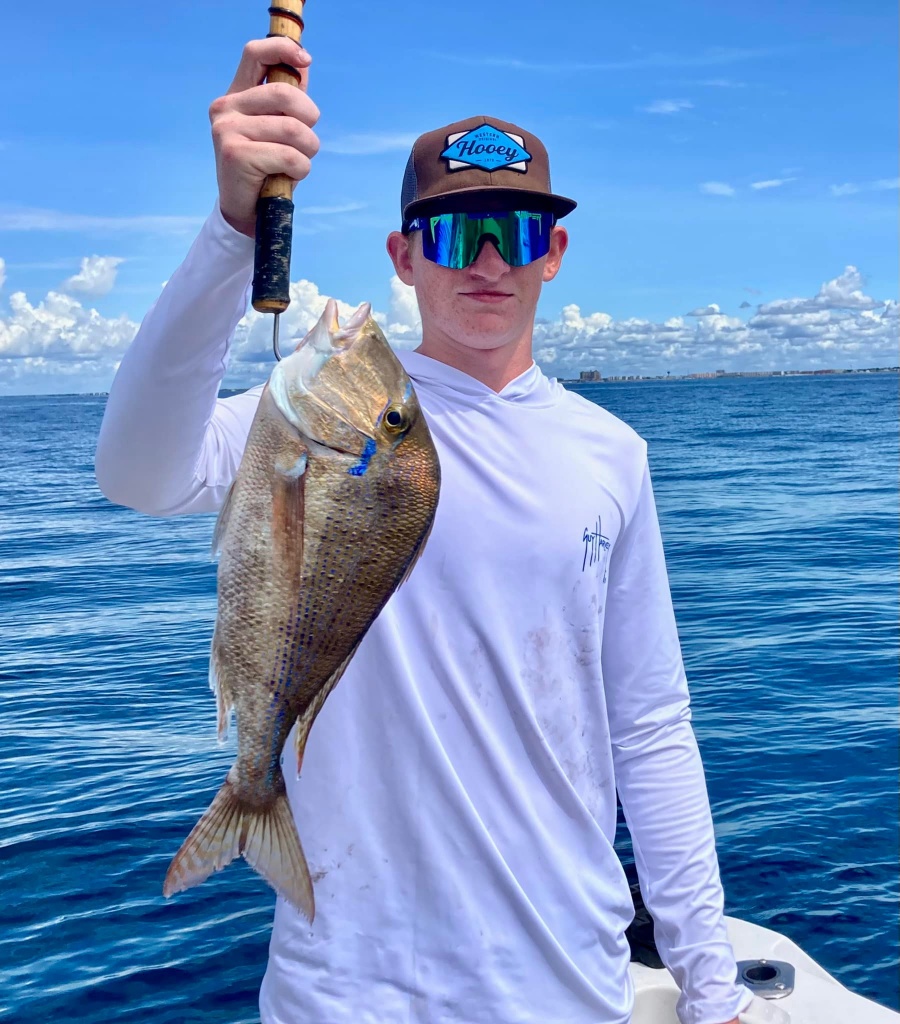 Angler with large fish in Shalimar