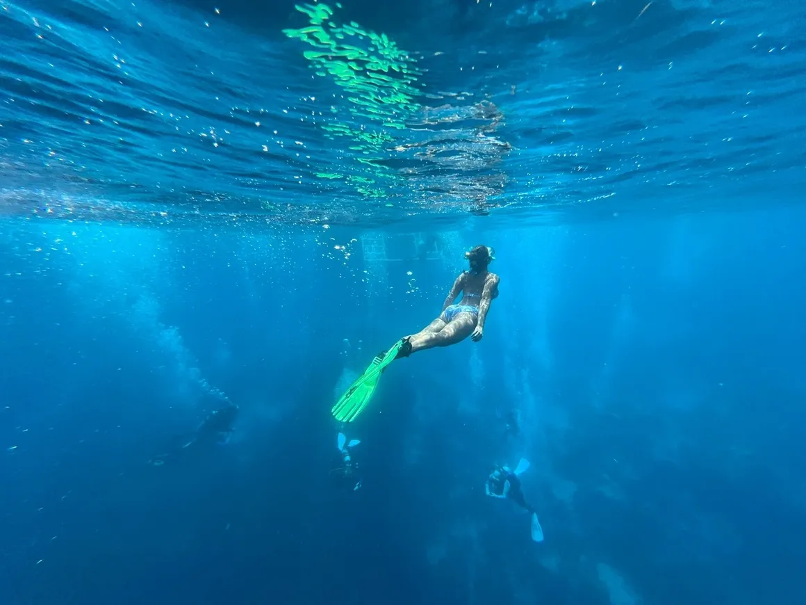 A scenic view of Key Largo, showcasing the beautiful water and outdoor activities like fishing and water sports.