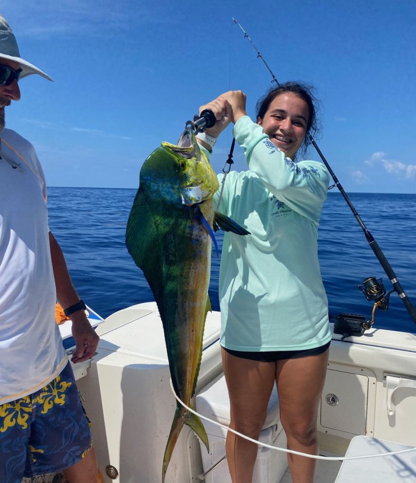 Florida Keys offshore fishing charter boat with anglers catching snapper and mahi mahi