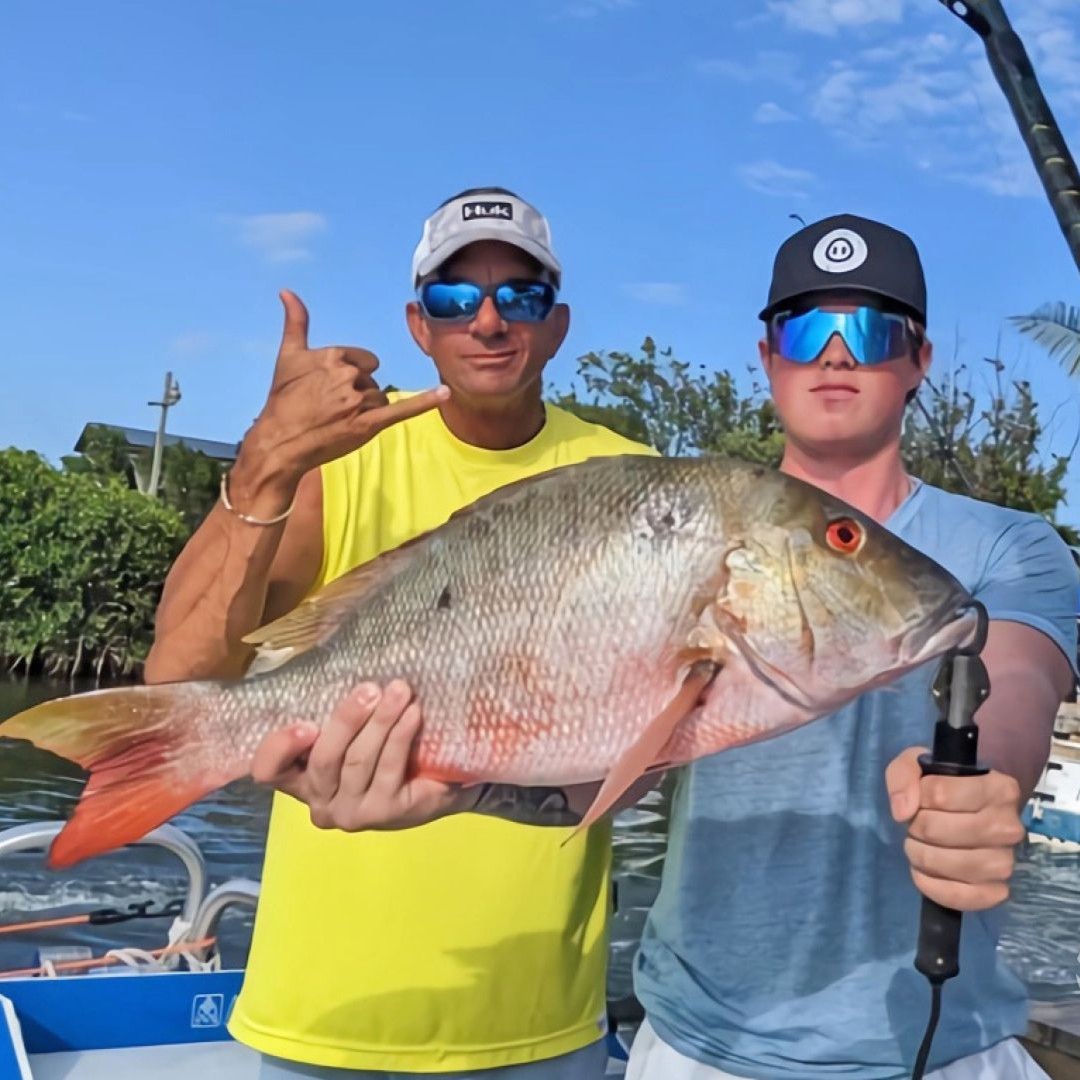 Florida Keys fishing charter boat with anglers trolling for Mahi Mahi and Snapper in Gulf Stream
