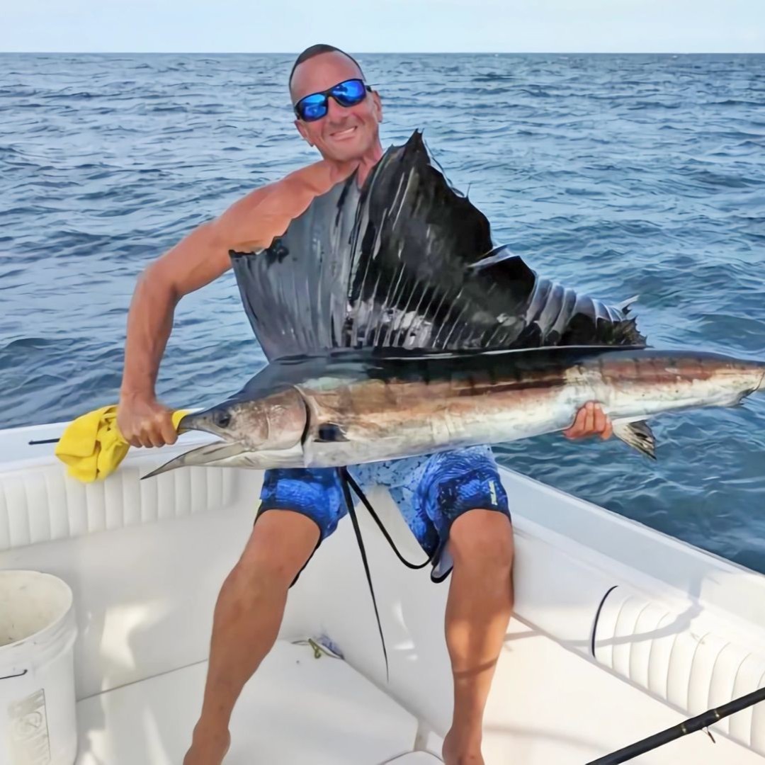 Florida Keys offshore fishing charter boat with anglers catching Mahi Mahi and Grouper in Gulf Stream