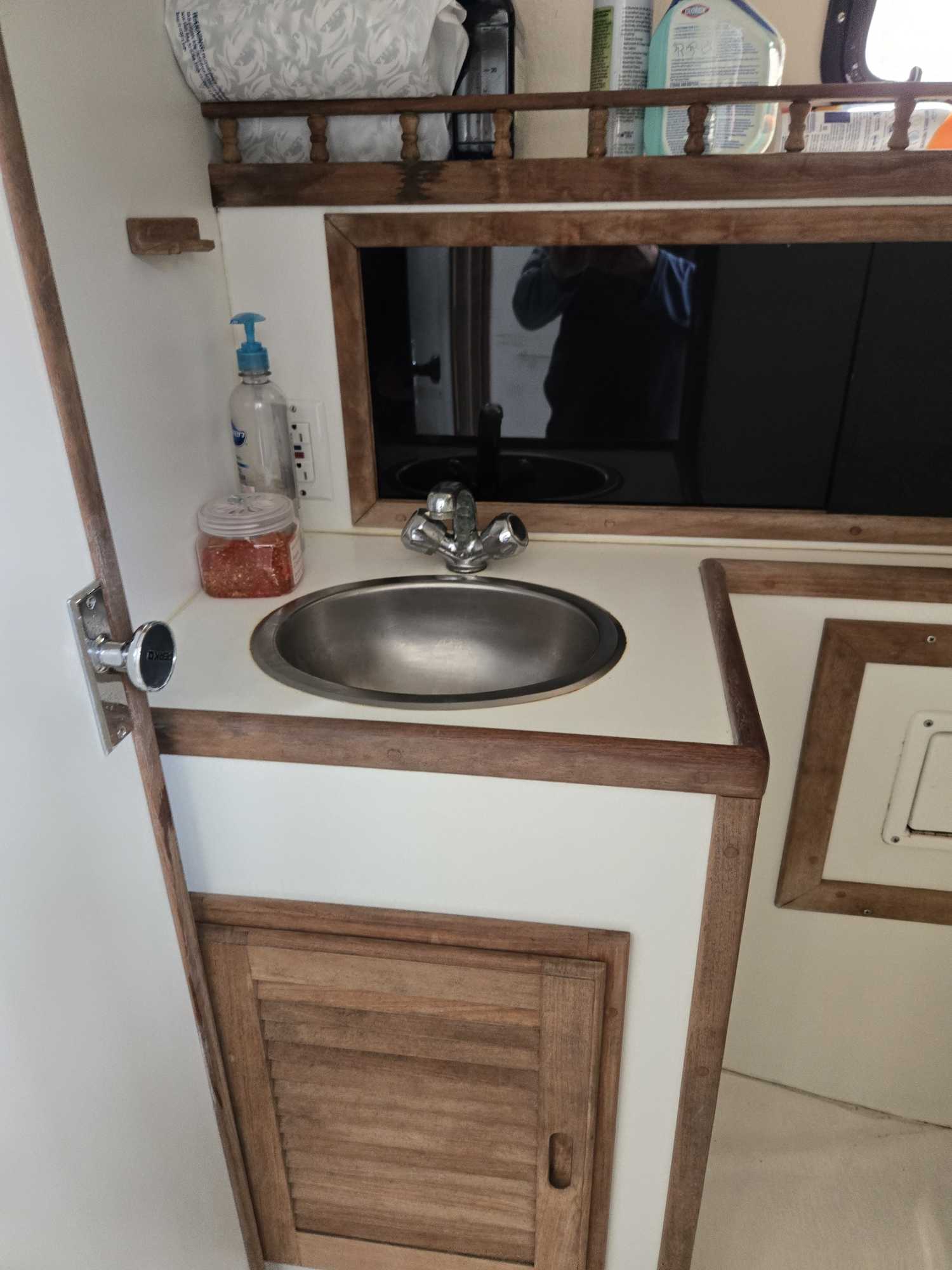 Compact fishing boat sink with stainless steel basin and chrome faucet in Cape Cod MA