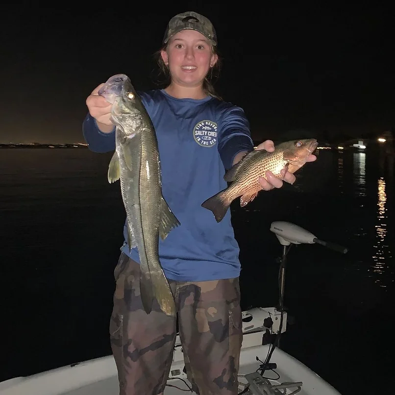 Two large grey snapper and snook fish caught in Lake Worth