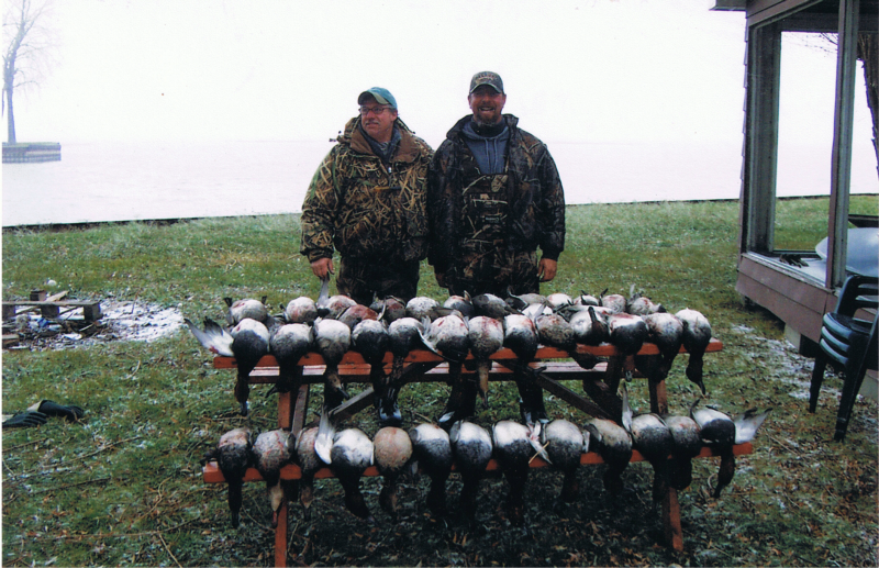 Two people in Blenheim enjoying fishing and hunting adventure