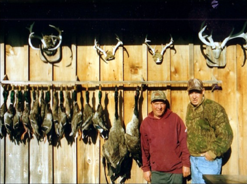 Two people fishing and hunting in Ontario