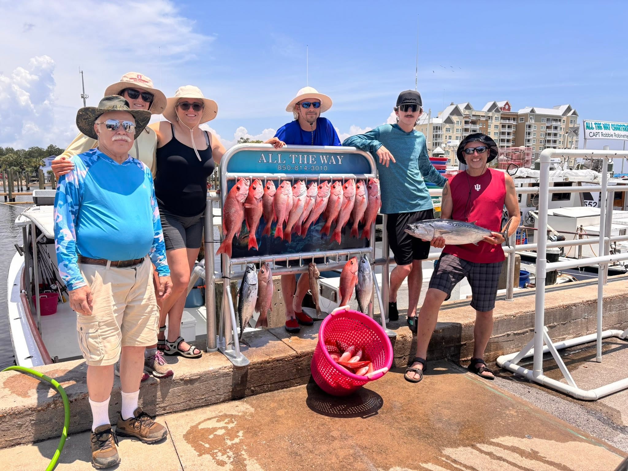 Successful fishing trip in Panama City FL showing Red Snapper and Little Tunny catch displayed at marina
