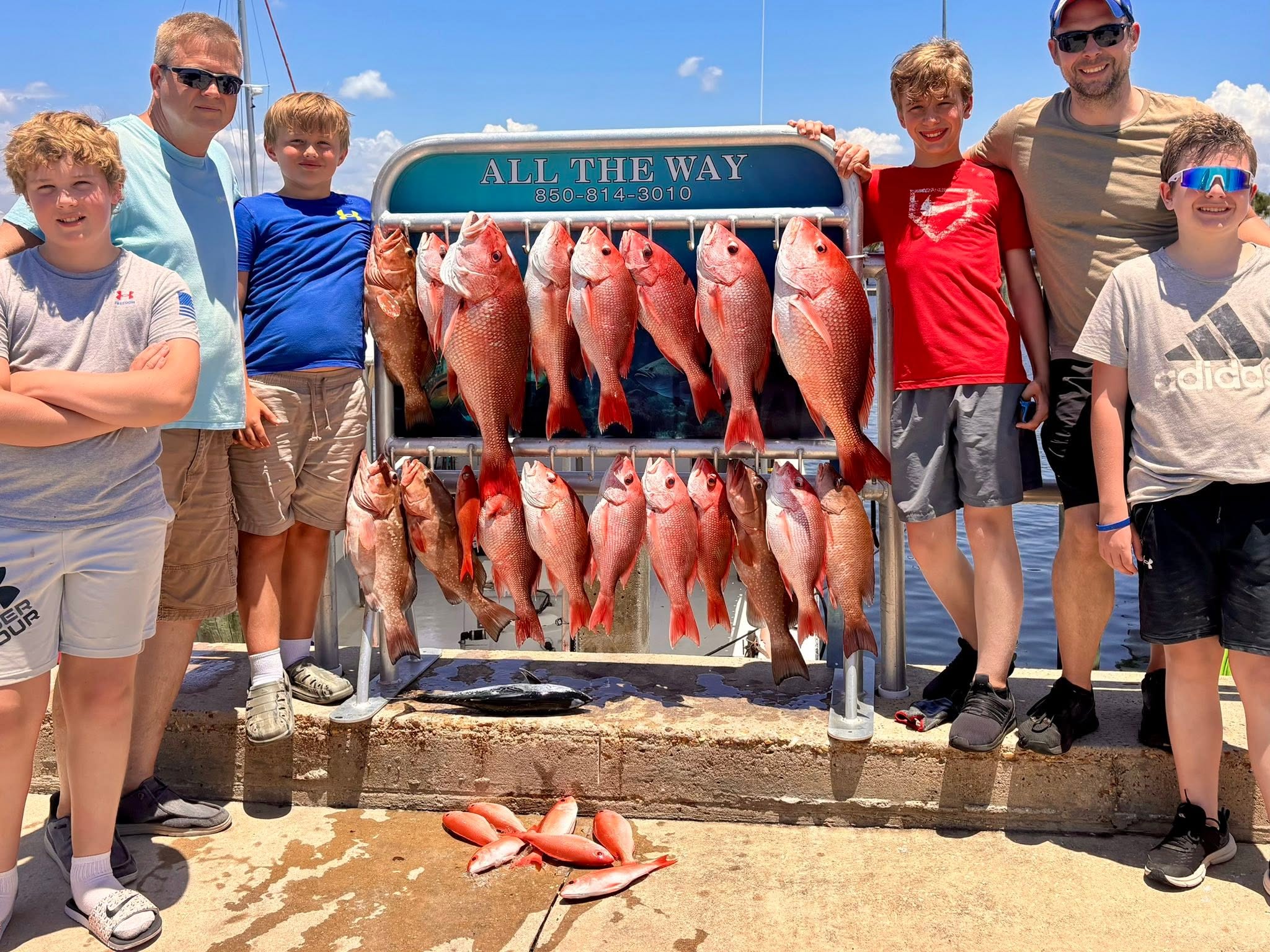 Red snapper and red grouper fishing catch displayed on charter boat rack in Panama City FL