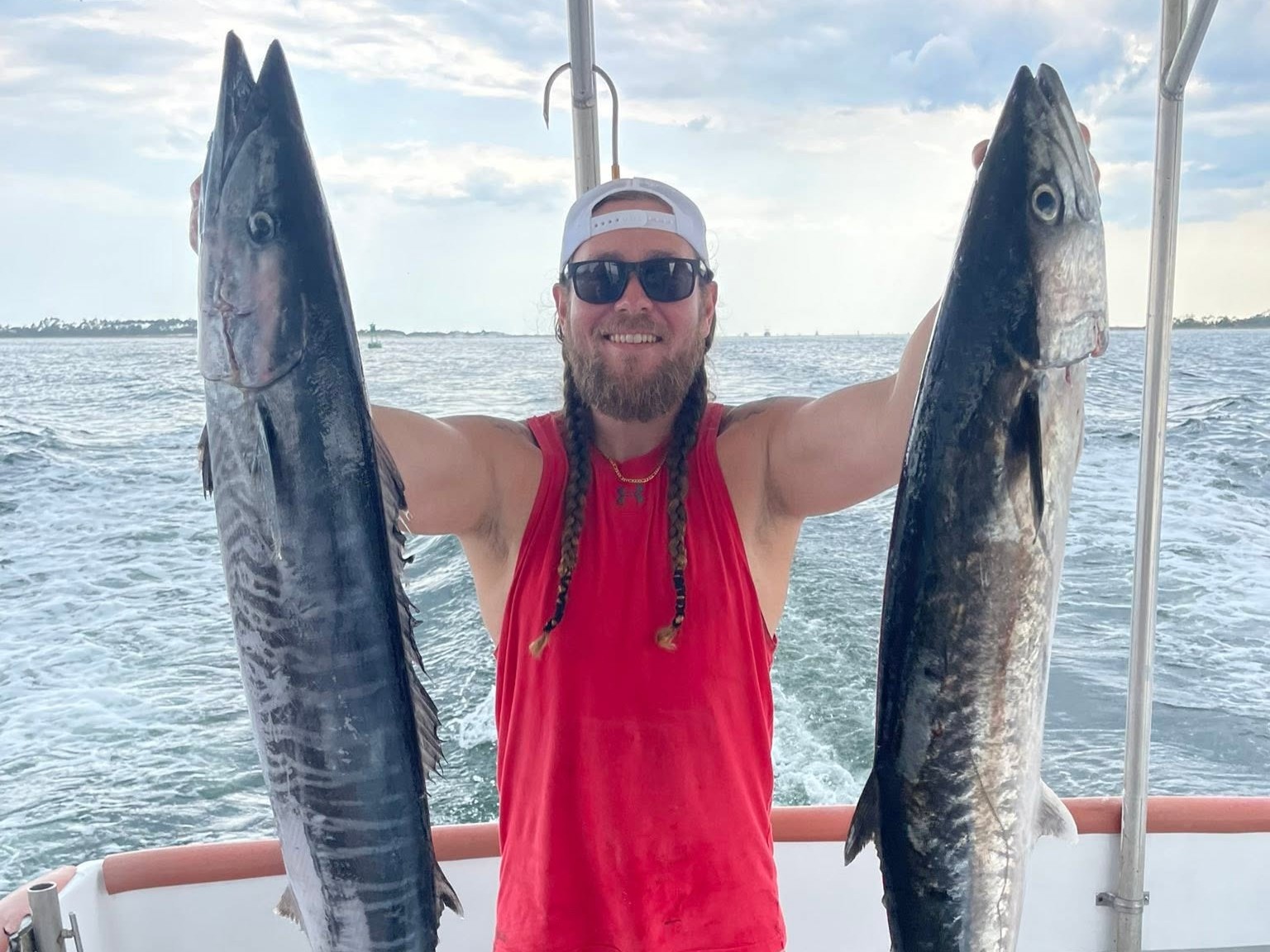 Offshore trolling fishing boat in Gulf waters near Panama City Florida targeting mackerel and mahi