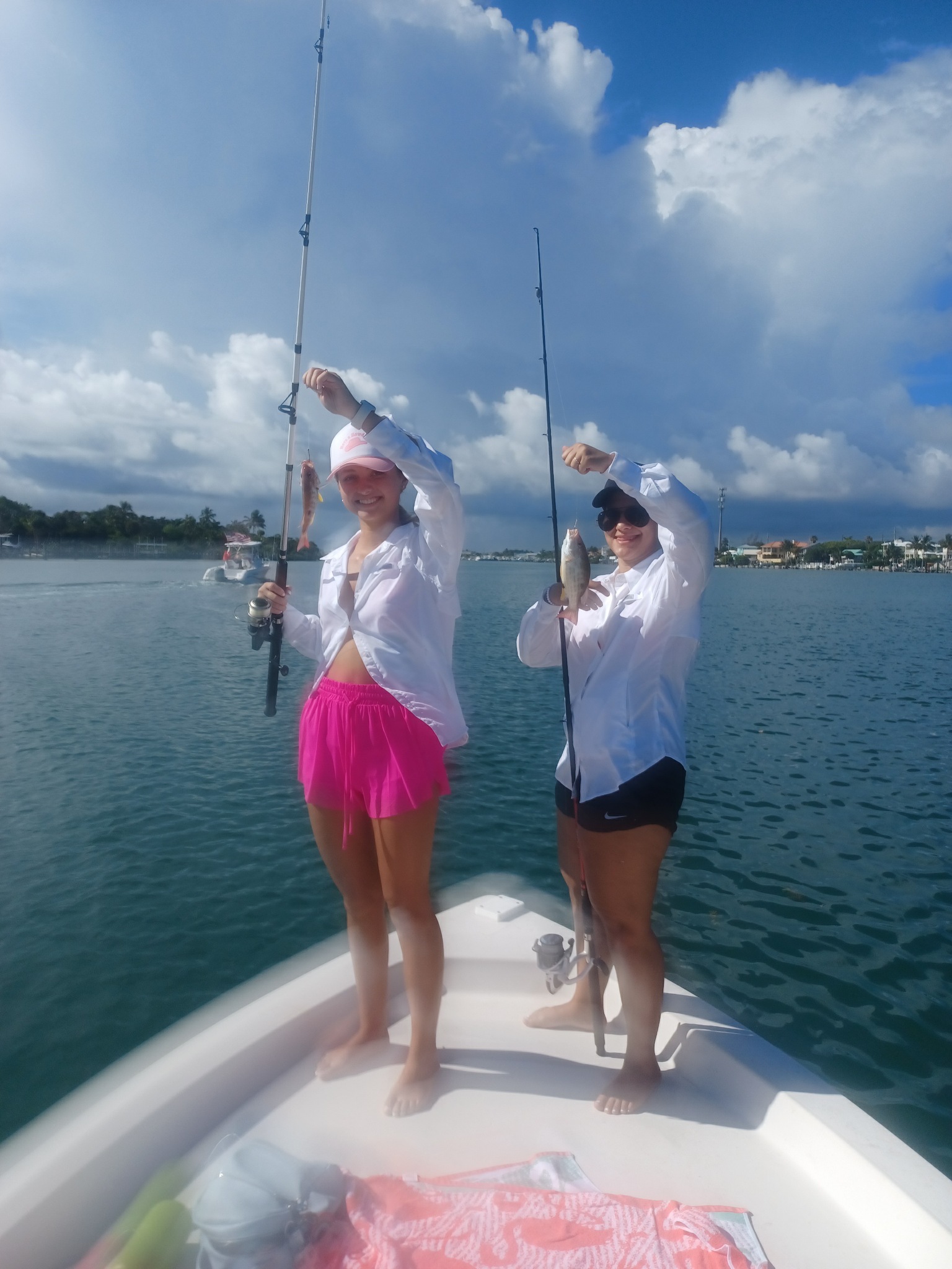 Two people enjoying a fishing trip in Jupiter