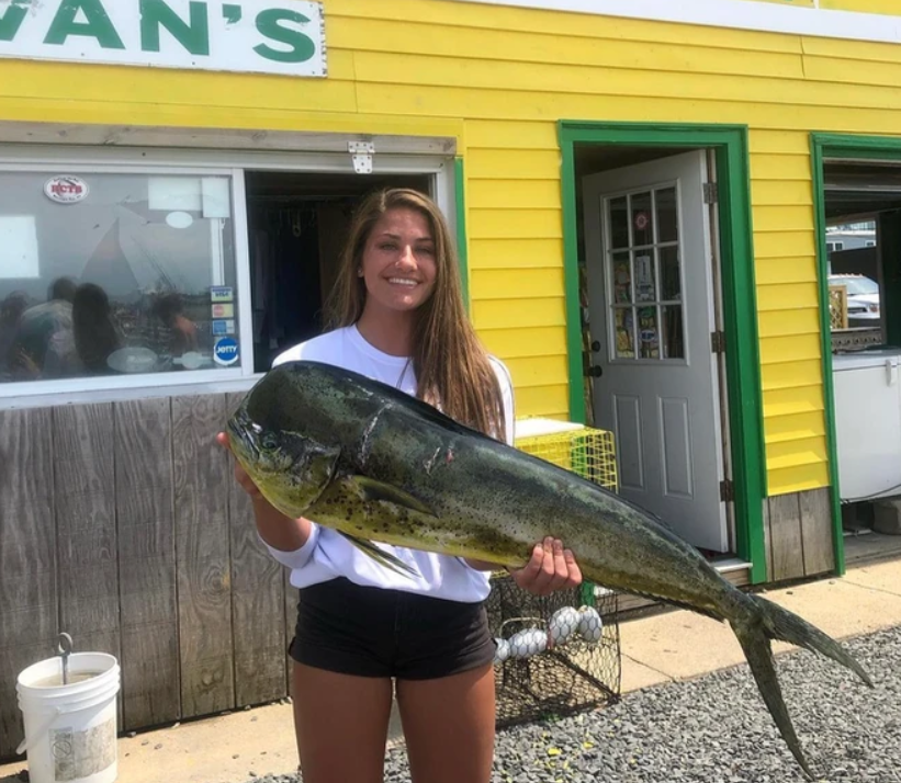 Angler catching a large fish in Barnegat Light