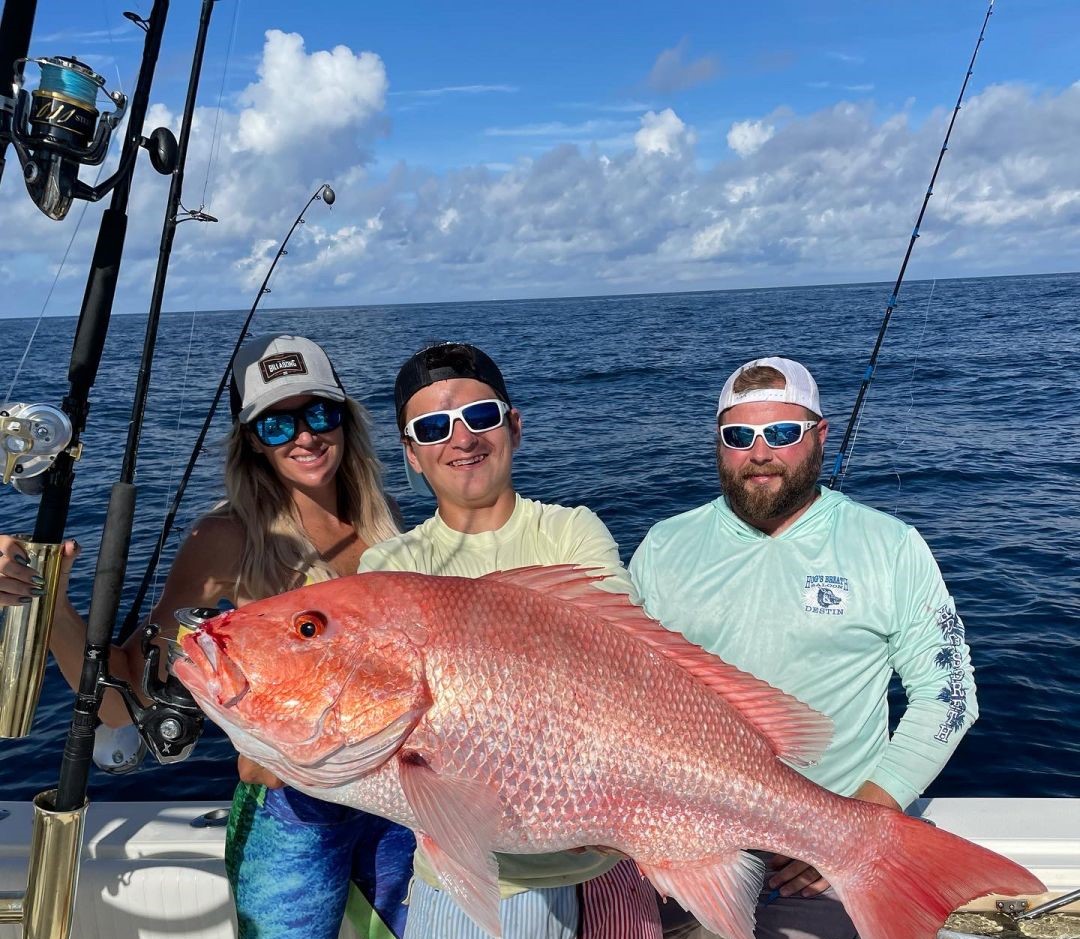 A group of 3 people fishing in FL