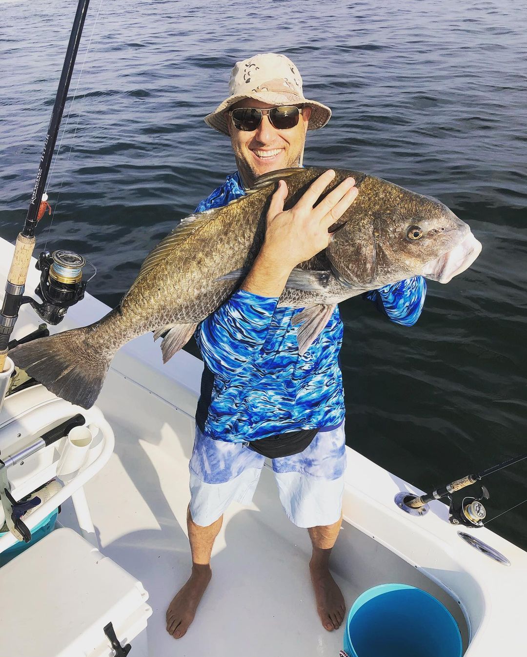 Angler with a large black drum fish in St. Petersburg