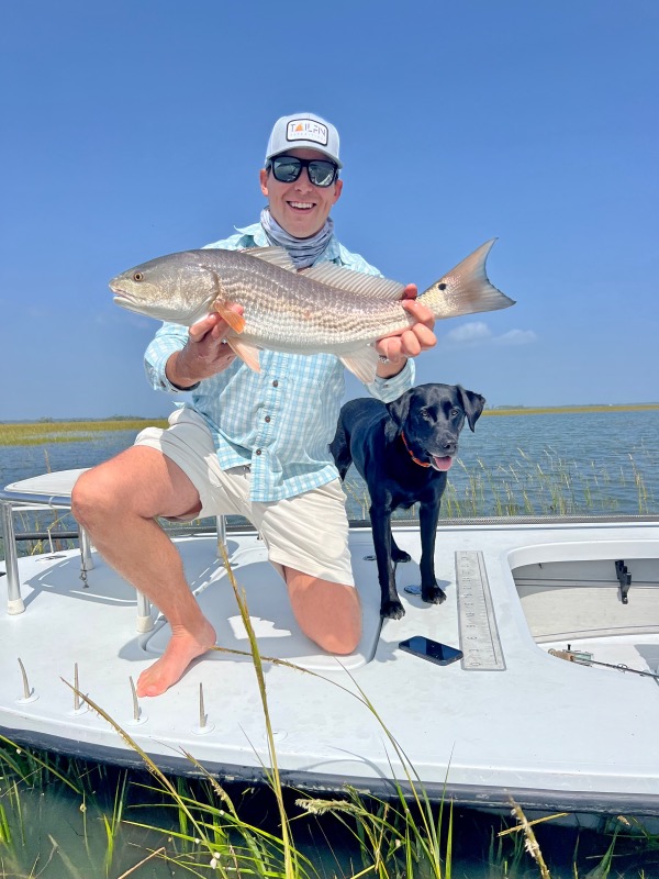 Fisherman catches a redfish in Charleston