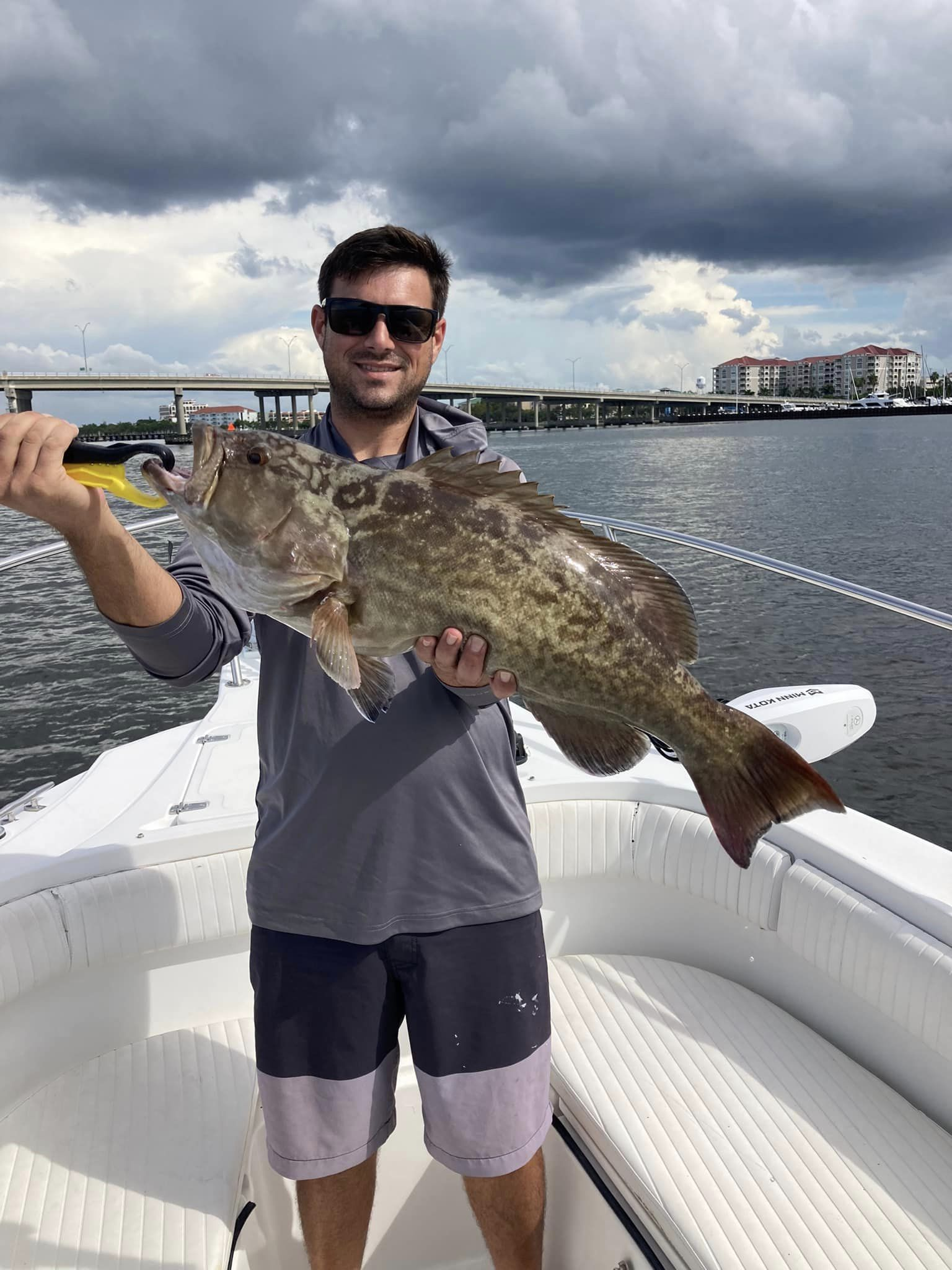 Fisherman with a large gag grouper catch in Palmetto